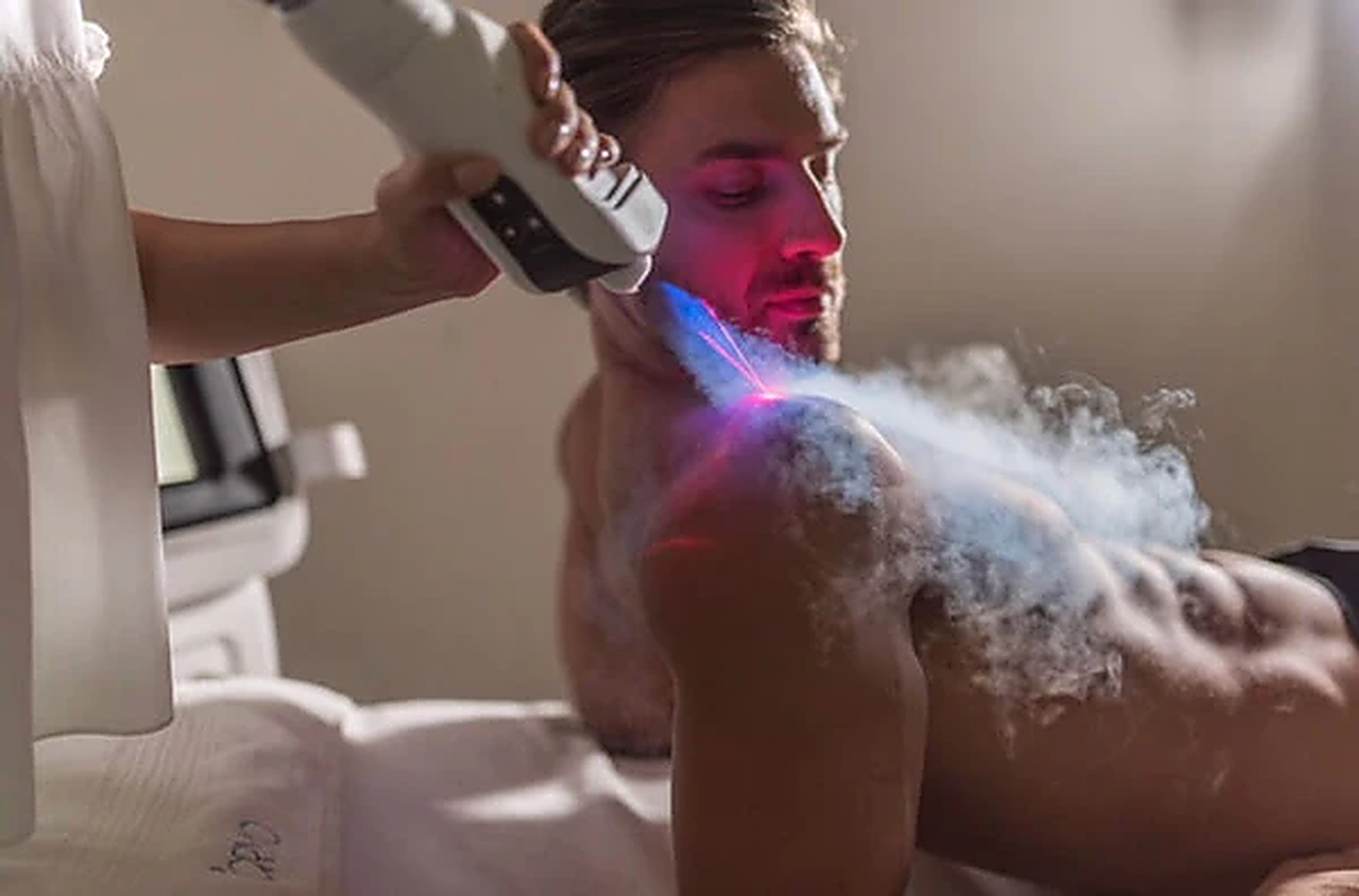 Cold air applied to a client's shoulder and neck during a localized cryotherapy session